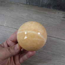 Load image into Gallery viewer, Large Orange Calcite Sphere