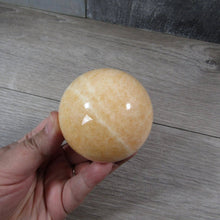 Load image into Gallery viewer, Large Orange Calcite Sphere
