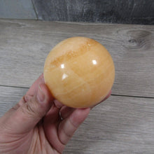 Load image into Gallery viewer, Large Orange Calcite Sphere

