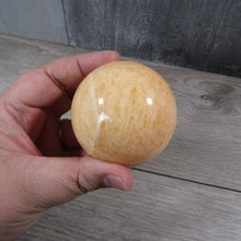 Load image into Gallery viewer, Large Orange Calcite Sphere

