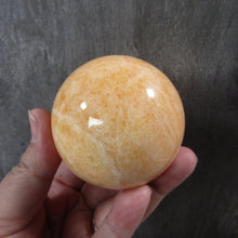 Load image into Gallery viewer, Large Orange Calcite Sphere
