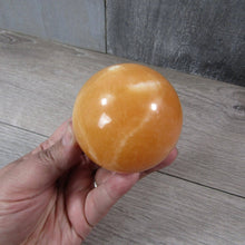 Load image into Gallery viewer, Large Orange Calcite Sphere

